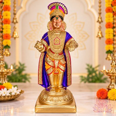 Ornate Deity in Festive Temple Altar